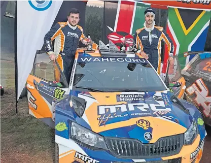  ??  ?? Drew Sturrock and Manvir Baryan have made history in their Skoda R5.