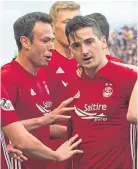  ??  ?? Ross McCrorie, top, celebrates his equalising goal for Rangers after Kenny McLean had given the Dons the lead.