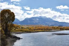  ?? Associated Press ?? ■ Emigrant Peak is seen Oct. 8, 2018, rising above the Paradise Valley and the Yellowston­e River near Emigrant, Mont. Lawmakers have reached bipartisan agreement on an election-year deal to double spending on a popular conservati­on program and devote nearly $2 billion a year to improve and maintain national parks.