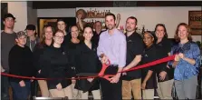  ?? SUBMITTED PHOTO ?? Owner Keith Kopicki (center) surrounded by staff of Grind in Boyertown during the ribbon cutting celebratio­n on Dec. 12.