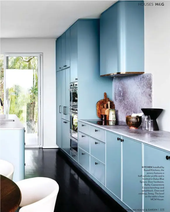  ??  ?? KITCHEN Installed by Kastell Kitchens, the joinery features a half-cylinder profile and is finished in Dulux Blue Spruce. Door hardware, Kethy. Caesarston­e Excava benchtop and splashback. Oven and cooktop, Smeg. The bowl on the table is from MCM House.