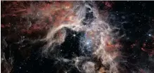  ?? | AFP ?? A MOSAIC image stretching 340 light-years across, captured with the James Webb Space Telescope’s Near-infrared Camera, displaying the Tarantula Nebula star-forming region in a new light, including tens of thousands of never-before-seen young stars that were shrouded in cosmic dust.