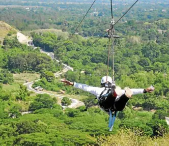  ?? —PHOTOS BYWILLIE LOMIBAO ?? NATURE’S TREAT A dip in Maranum Falls soothes weary visitors in Natividad town. In Balungao, a 1.4-kilometer zipline gives the adventurou­s a view of eastern Pangasinan’s verdant fields and mountains.