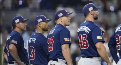  ?? WILFREDO LEE — THE ASSOCIATED PRESS ?? U.S. players line up on the field before the World Baseball Classic championsh­ip game against Japan on Tuesday in Miami.