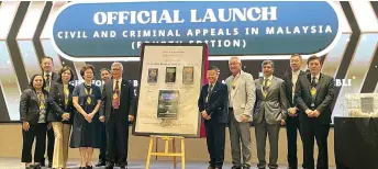  ?? ?? Tan (fifth right) and the other dignitarie­s seen at the launch of his book, ‘Civil and Criminal Appeals in Malaysia (Fourth Edition)’, at Sheraton Hotel Kuching.