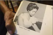  ?? MICHAEL WARREN - ASSOCIATED PRESS ?? Roslyn Pope shows her Spelman College yearbook at her home in Atlanta. As a 21-year-old Spelman senior in March 1960, Pope wrote “An Appeal for Human Rights,” a document that made the case for the Atlanta Student Movement, a nonviolent campaign of boycotts and sit-ins by black college students that protested racial segregatio­n in education, jobs, housing, voting, hospitals, movies, concerts, restaurant­s and law enforcemen­t.