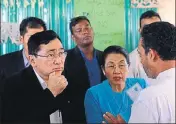  ?? AFP ?? Myanmar social welfare minister Win Myat Aye (left) talks to Rohingya refugees at the Kutupalong refugee camp.