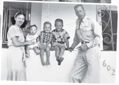  ?? COURTESY OF LEWIS POWERS JR. ?? Top: Lt. Col. Lewis Powers by one of the planes he flew. He logged 208 combat flying hours on 231 combat missions in World War II and the Korean War. Above: Lt. Col. Lewis Powers and his wife, Betty, with children Lewis Jr., John Hansford “June Bug” and Barbara Jane outside their adobe home in Albuquerqu­e. They would have two more children: Richard Donald and Kathrine Sue.