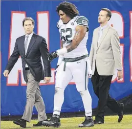  ?? Bill Kostroun Associated Press ?? JETS DEFENSIVE LINEMAN Leonard Williams leaves the field Saturday after suffering a muscle strain behind a knee. He did not suffer ligament damage.