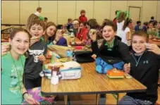  ?? DIGITAL FIRST MEDIA FILE PHOTO ?? East Vincent Elementary School students hold up spinach smoothies they enjoyed during their lunch period. As children age and grow, their nutritiona­l needs change as well.