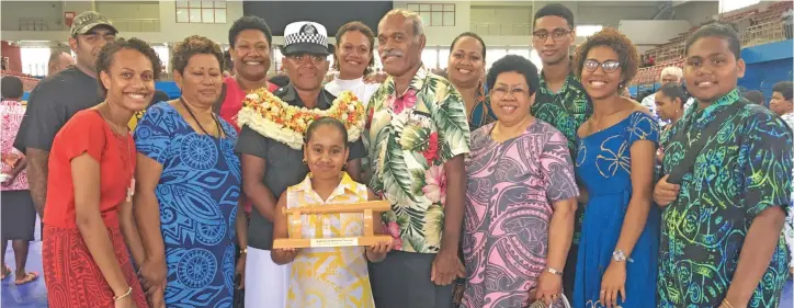  ?? Photo: Renu Radhika ?? Police officer Ulamila Karisitian­a (garland) with her proud family members after the passing-out parade at the Vodafone Arena in Suva on January 17, 2020.