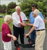  ?? EVAN BRANDT — MEDIANEWS GROUP ?? State Rep. Tim Hennessey, R-23rd Dist., presents a proclamati­on from U.S. Sen. Pat Toomey congratula­ting the couple on 80 years of marriage.