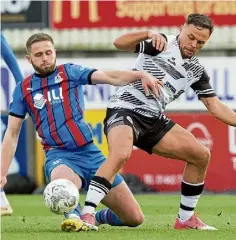  ?? ?? ICT’s Danny Devine slides in to win a tackle.