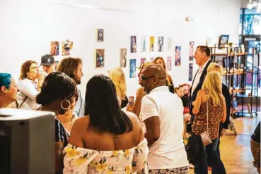  ?? CONTRIBUTE­D ?? A crowd enjoys an Artspace Hamilton Lofts exhibit.