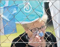  ?? AP PHOTO ?? A woman cries in front of a fence enclosing the Mar de Plata Naval Base Thursday after learning that Argentina’s navy announced that a sound detected during the search for the missing ARA San Juan submarine is consistent with that of an explosion.