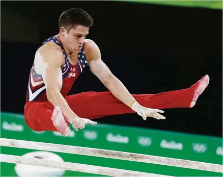  ?? Rebecca Blackwell / Associated Press ?? Chris Brooks of Houston was one of the steadier performers for the U.S. men, who slipped to fifth place Monday.