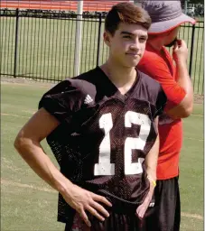  ?? MARK HUMPHREY ENTERPRISE-LEADER ?? Farmington junior Trey Waggle, shown in a recent practice, is competing for the starting quarterbac­k job with senior Jake Oskey. Each led an offense during Tuesday’s Red and White game to kick off the Farmington football season.