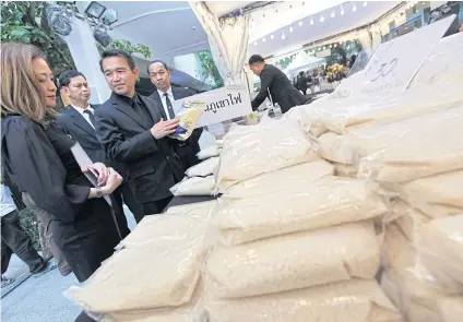  ?? WICHAN CHAROENKIA­TPAKUL ?? Thai rice on sale at a department store in Bangkok. Mexico offers tariff-free quota for long-grain white rice until end of the year to lower its food costs.