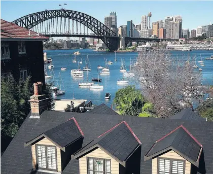  ?? Picture / Bloomberg ?? In September 1999, John Howard’s government changed the way the capital gains tax was calculated. At this point the median Sydney house price was A$289,730 compared with A$1.1 million in 2016.
