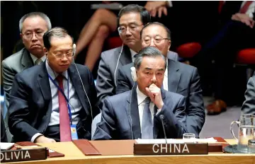  ??  ?? China’s Foreign Minister Wang Yi and the Chinese delegation listen to US President Donald Trump address the UN Security Council meeting at the 73rd session of the United Nations General Assembly at UN headquarte­rs in New York. — Reuters photo