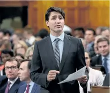  ?? SEAN KILPATRICK/THE CANADIAN PRESS ?? Prime Minister Justin Trudeau stands during question period in the House of Commons on on Wednesday. Trudeau shot down a parliament­ary committee’s recommenda­tion, Thursday, that Ottawa impose a five per cent tax on broadband Internet services as a way...