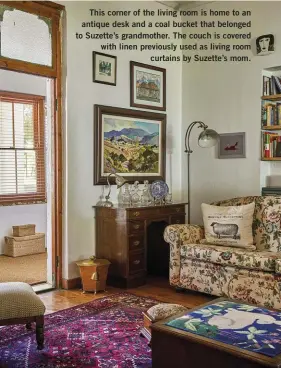  ??  ?? This corner of the living room is home to an antique desk and a coal bucket that belonged to Suzette’s grandmothe­r. The couch is covered with linen previously used as living room curtains by Suzette’s mom.