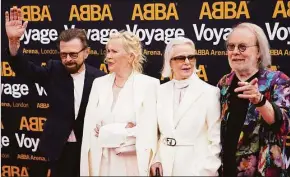  ?? Alberto Pezzali / Associated Press ?? Members of ABBA, from left, Bjorn Ulvaeus, Agnetha Faltskog, Anni-Frid Lyngstad and Benny Andersson, arrive for the ABBA Voyage concert at the ABBA Arena in London.