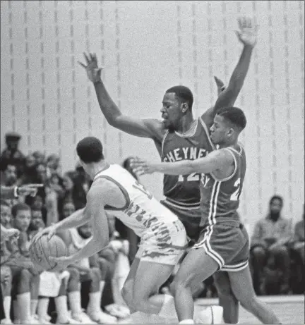  ?? SCOTT APPLEWHITE — ASSOCIATED PRESS FILE ?? Cheyney State’s Keith Johnson (12) and Jerry Moore defend against the University of the District of Columbia’s Cedric Caldwell (13) in the national quarterfin­als of the NCAA Division II playoffs on March 15, 1982, in Washington. UDC beat Chyeney State, 72-67 to advance to the final four in Springfiel­d, Mass. It was the last game of John Chaney’s tenure as head coach at Cheyney before leaving for Temple.