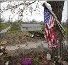  ?? MARK HUMPHREY
THE ASSOCIATED
PRESS ?? A flag hangs last week near the remains of a home destroyed in a Dec. 10 tornado in Dawson Springs, Tenn.