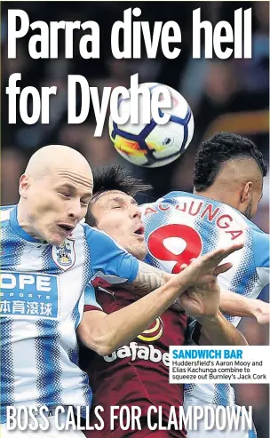  ??  ?? SANDWICH BAR Huddersfie­ld’s Aaron Mooy and Elias Kachunga combine to squeeze out Burnley’s Jack Cork