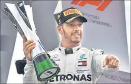  ?? AFP ?? Mercedes' Lewis Hamilton on the podium after winning the Italian Formula One Grand Prix at the Autodromo Nazionale circuit in Monza on Sunday.