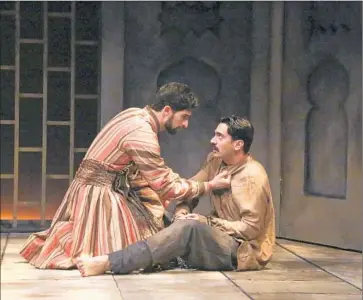 ?? Michael Lamont ?? RAFFI BARSOUMIAN, left, and Ramiz Monsef engage in forbidden chatter in a “Guards at the Taj” scene.