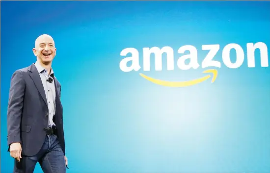  ?? (AP) ?? In this file photo, Amazon CEO Jeff Bezos walks onstage for the launch of the new Amazon Fire Phone, in Seattle. Amazon has had a complicate­d few weeks with its cancellati­on of a New York headquarte­rs, Feb 14 and extortion claims last week related to intimate photos taken by its founder. Experts say the events are unlikely to pose much of a threat to Amazon’s business. But thecompany will continue to face more challenges as it grows larger.