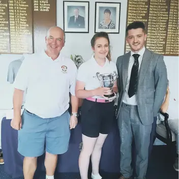  ??  ?? Jade Roberts was presented with the James Berry Trophy by club captain Ian Smith (left) and Richard Berry.