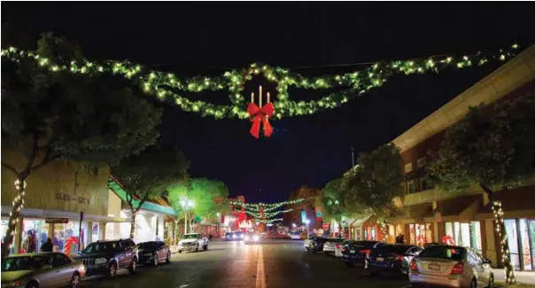  ?? COURTESY OF MAIN STREET HANFORD ?? Downtown Hanford is decorated for the holiday season. Guests to Winter Wonderland will enjoy free horse-drawn wagon rides through the district.