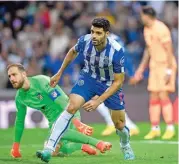  ?? (AFP) ?? Porto's Mehdi Taremi celebrates after scoring against Atletico Madrid in their Champions League match on Tuesday