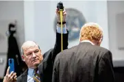  ?? JOSHUA BOUCHER / THE STATE ?? Defense attorney Jim Griffin measures Alex Murdaugh at his trial in Walterboro, S.C., on Thursday. Murdaugh is standing trial on two counts of murder in the 2021 shootings of his wife and son.