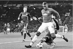  ??  ?? CSKA Moscow’s Mario Fernandes tackles Manchester United’s Paul Pogba during the UEFA Champions League Group A match at Old Trafford in Manchester, north west England in this Dec 5 file photo. — AFP photo