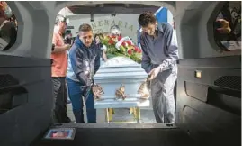  ?? ?? The casket of Jocelyn Anselme is placed into a hearse June 2. Anselme, 34, reportedly died a few days after being turned away from a Tijuana hospital. He had been beaten and robbed.