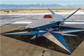  ?? Damian Dovarganes/Associated Press ?? The XQ-67A unmanned aerial vehicle, a prototype of an AI drone fleet being developed under the Air Force Research Laboratory, sits at General Atomics’ test facility in Palmdale.