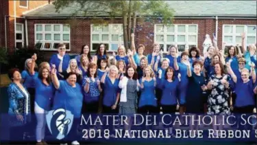  ?? PHOTO COURTESY OF MATER DEI ?? Faculty members Mater Dei Catholic School in Lansdale pose outside the school after hearing that the school has earned a 2018 National Blue Ribbon Award from the U.S. Department of Education.