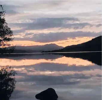  ??  ?? Dark skies Sunset along Loch Venachar by Vanessa Mcallister