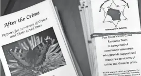  ?? WM. GLASHEEN/USA TODAY NETWORK-WISCONSIN ?? The Fox Cities Victim Crisis Response team prepares pamphlets to give to people in need after crimes and other traumatic events. Recently, they’ve been hosting office hours at the Fox River Mall in Grand Chute following a fatal shooting at the mall a few weeks ago.