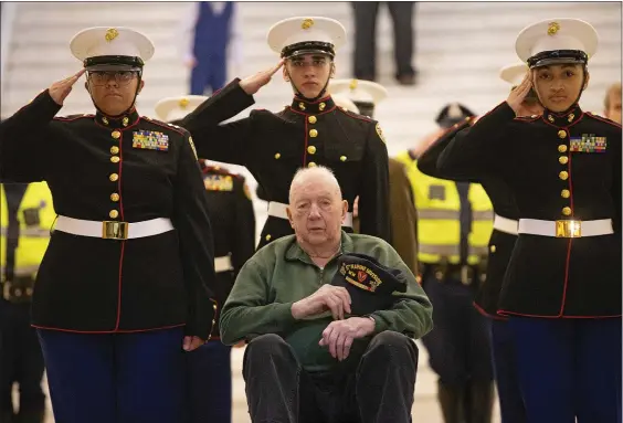  ?? MATT STONE — BOSTON HERALD ?? Walter “Miz” O’Malley, a World War II veteran who fought in Iwo Jima, is flanked by Marine cadets at a State House ceremony yesterday. O’Malley is one of the last few from that epic battle.