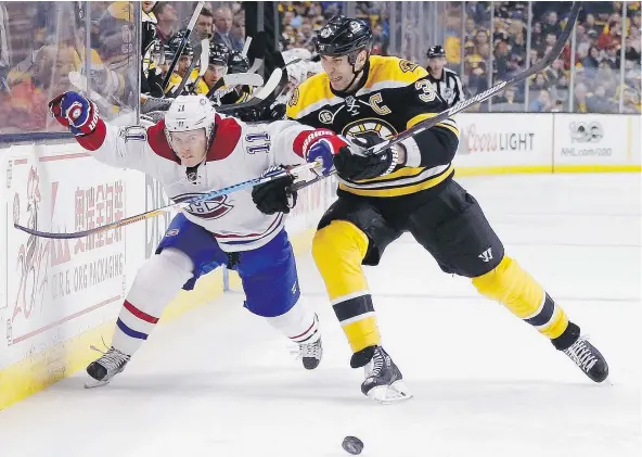  ??  ?? Boston Bruins’ captain Zdeno Chara checks Montreal Canadiens’ Brendan Gallagher during recent NHL action. Chara feels the hiring of former Bruins coach Claude Julien by the Canadiens was a logical move. — THE ASSOCIATED PRESS FILES