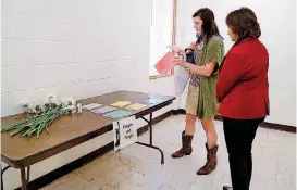  ?? [PHOTO BY JIM BECKEL, THE OKLAHOMAN] ?? Olivia Coday and Sherry Sullivan participat­e in a domestic violence simulation at the “In Her Shoes” seminar on Thursday at Wildewood Christian Church (Disciples of Christ), 6900 N Kelley.