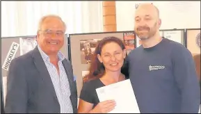  ??  ?? Louise and Darren Lavender from The New Plough in Hinckley received a certificat­e from Camra chief executive Tim Page, left, at the tenth Hinckley Beer Festival to mark their pub’s inclusion in the 2018 Good Beer Guide. Picture: Alan Cooke Dawn and...