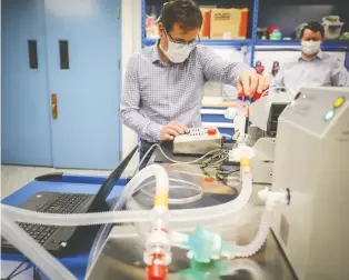  ?? AHS ?? An Exergy Solutions team member tests one of 200 ventilator­s developed and manufactur­ed in Alberta.