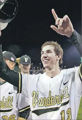  ?? Vanderbilt athletic depar t ment ?? WALKER BUEHLER celebrates Vanderbilt’s 2014 College World Series crown.