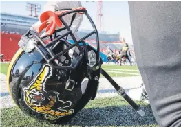  ?? JEFF MCINTOSH THE CANADIAN PRESS ?? The Hamilton Tiger-Cats took part in a chilly practice in Calgary on Friday in preparatio­n for Sunday’s Grey Cup game against the Winnipeg Blue Bombers.